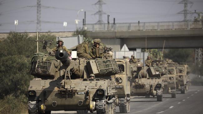 Israeli artillery vehicles travel on a highway near the border with the Gaza Strip. Photo: Amir Levy/Getty Images