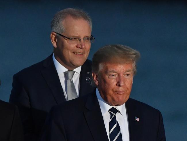 U.S. President Donald Trump and Australia's Prime Minister Scott Morrison at the family photograph during the G7 Summit in the town of Biarritz, 800km south of Paris in France, Sunday, August 25, 2019.  (AAP Image/Mick Tsikas) NO ARCHIVING