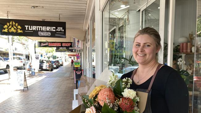 Candice Cowden, owner of Karinya Florist and Gifts, said Mary St was “going in the right direction” and the number of shops in the end of the street submerged in February 2022 was growing.