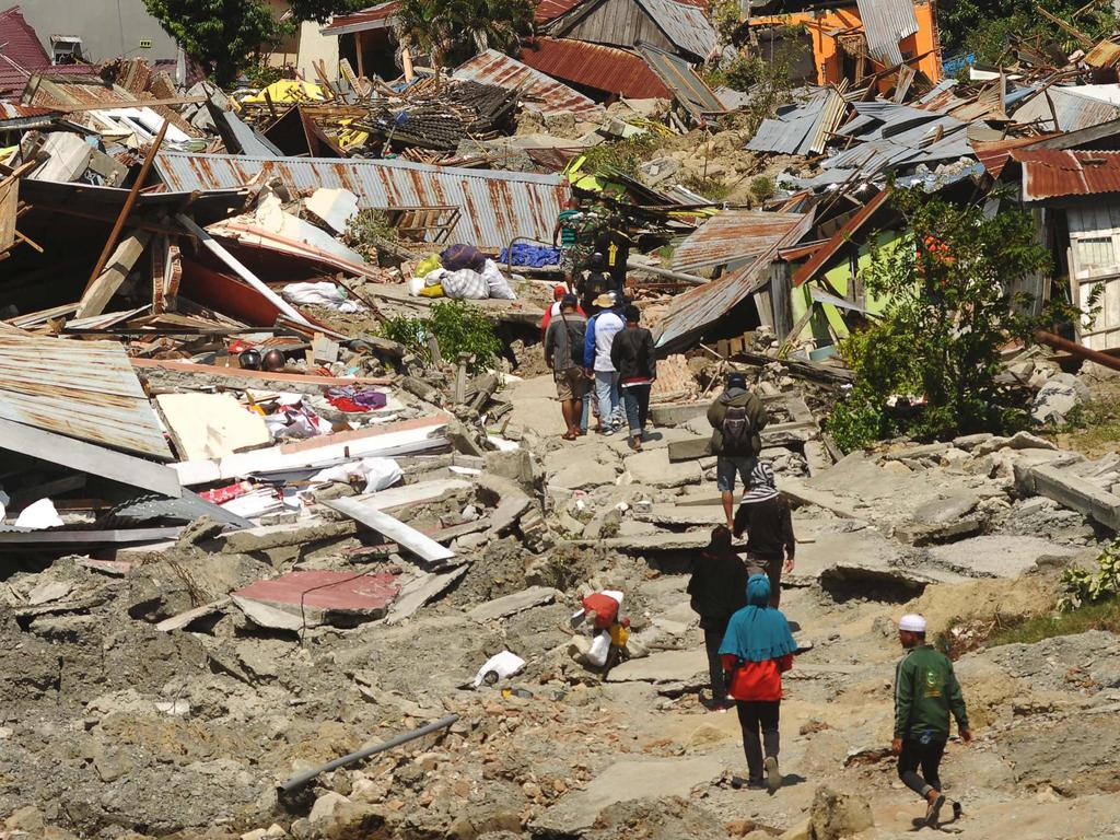 Indonesia Earthquake, Tsunami: Victims Buried In Mass Graves As Death ...