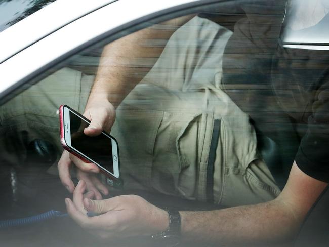 We have become so dependent on our phones, many are using it behind the wheel. Picture: Liam Kidston