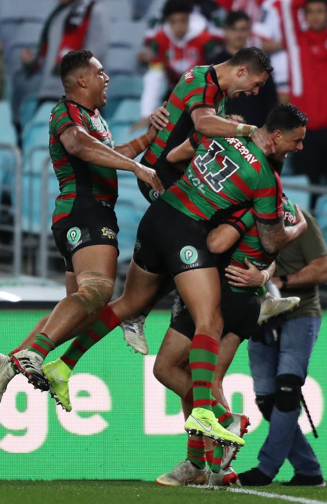 The Rabbitohs celebrate Campbell Graham’s match winner. Picture: Brett Costello