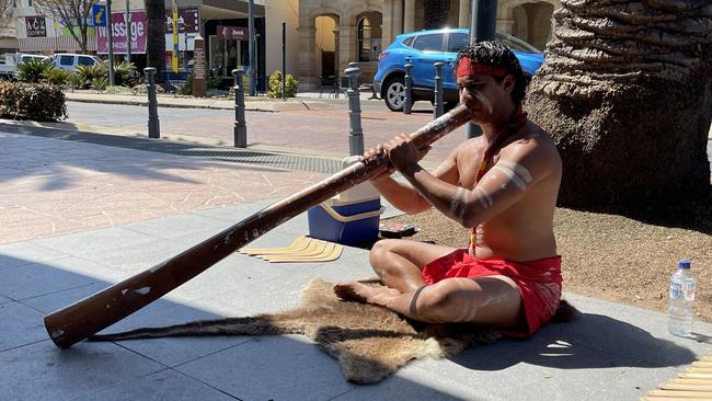 Jahmarley Dawson busking outside the Rose City Shopping Centre. Photo: Madison Mifsud-Ure / Warwick Daily News