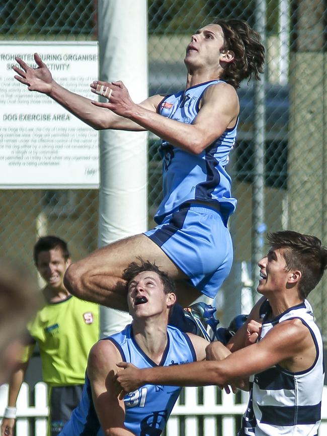 Riley Grundy flies for a mark for Sturt. Picture: Mike Burton