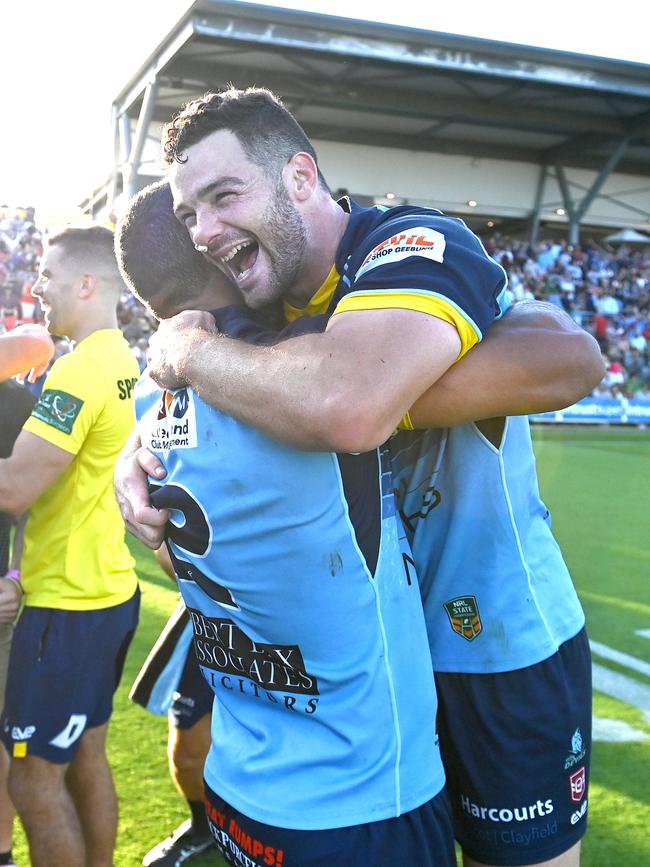 BRISBANE, AUSTRALIA - OCTOBER 10: Connor Broadhurst and Leivaha Pulu of the Devils celebrate victory after the 2021 QRL Intrust Super Cup Grand Final match between the Norths Devils and the Wynnum-Manly Seagulls at Moreton Daily Stadium on October 10, 2021, in Brisbane, Australia. (Photo by Bradley Kanaris/Getty Images)