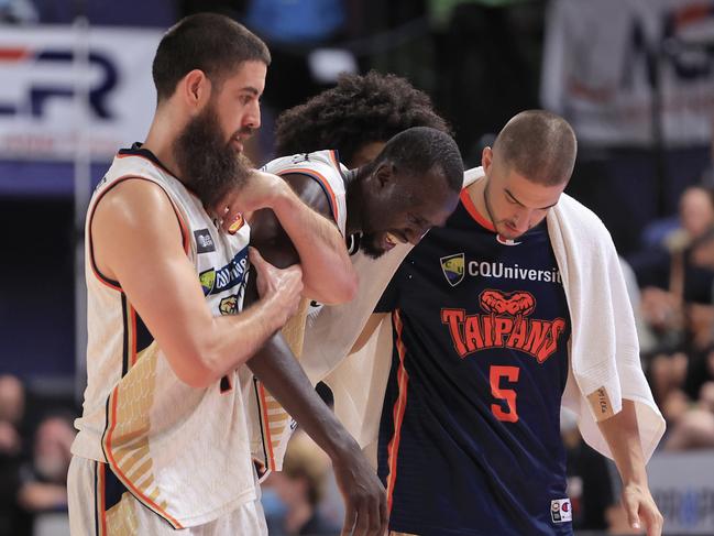 Majok Deng of the Taipans is helped off the court. (Photo by Mark Evans/Getty Images)