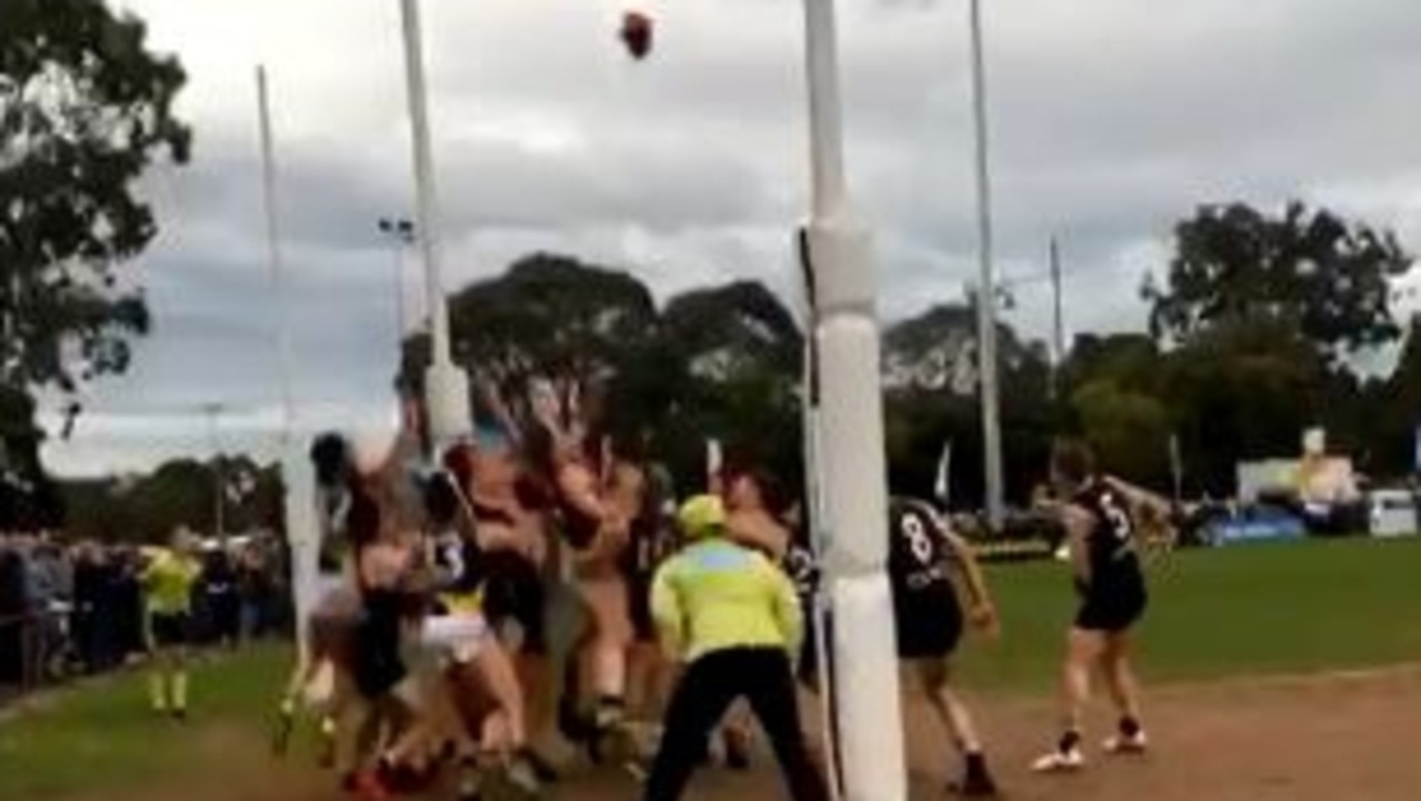 Players on the goal line in the EFL Division 2 grand final between Ringwood and Mitcham.