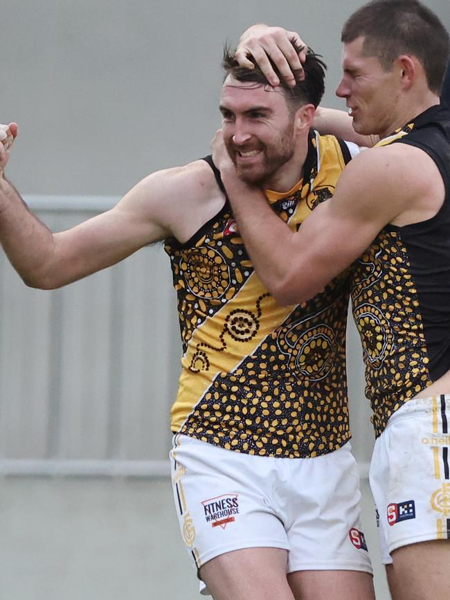 Liam McBean is congratulated by Glenelg teammate Matthew Allen after kicking a goal against Norwood on Saturday. Picture: David Mariuz (SANFL)