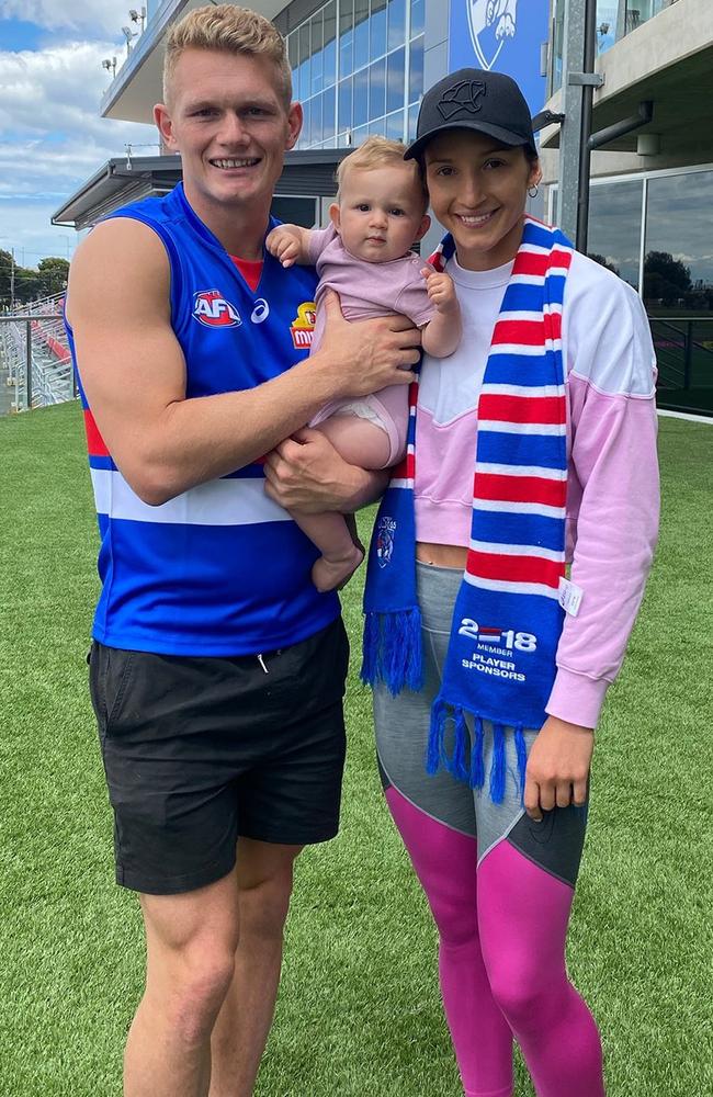 Adam Treloar and Kim Ravallion, with daughter Georgie, have found a way to balance both family life and their high-profile sporting careers.