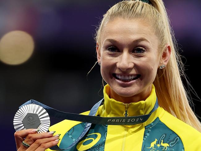 PARIS, FRANCE - AUGUST 10:  Silver medalist Jessica Hull of Team Australia celebrates on the podium during the Women's 1500m medal ceremony on day fifteen of the Olympic Games Paris 2024 at Stade de France on August 10, 2024 in Paris, France. (Photo by Al Bello/Getty Images)