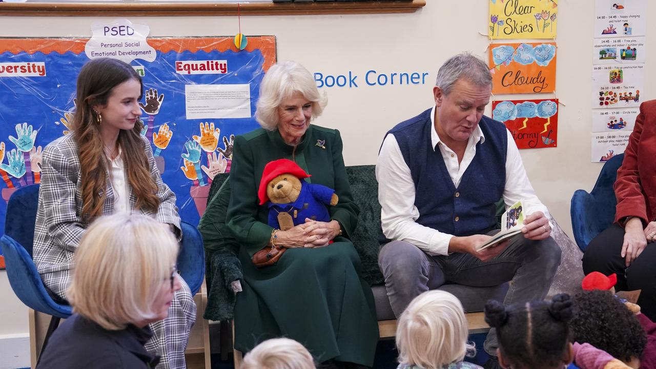 Camilla, Queen Consort with Madeleine Harris and Hugh Bonneville. Picture: Getty Images.