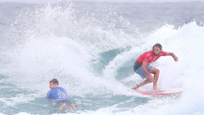 Final of the Quiksilver Pro Surfing contest at Snapper Rocks on the Gold Coast. Cop that! Mens Final winner Matt Wilkinson gives his opponent Kolohe Andino a spray, literally. Picture Glenn Hampson