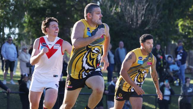 Guy Sebastian (right) and Brendan Fevola team up for the struggling Masala Thirds. Picture: David Crosling
