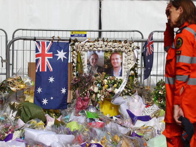 Thousands of bouquets and cards were left in Martin Place in tribute to Tori and Katrina.