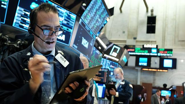 Traders work on the floor of the New York Stock Exchange. Picture: Getty Images