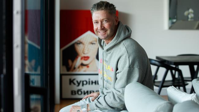 Clarke, pictured kicking back at home in his Balenciaga trackies, is looking to reboot his image. Picture: Tim Pascoe