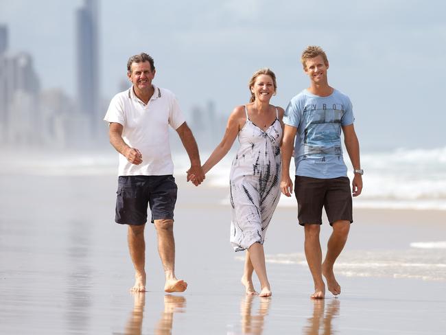 Lincoln Greaves with his mum Wendy and dad Lionel at Nobby's Beach. Pics Adam Head