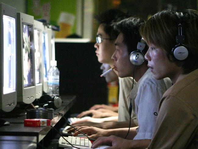 Chinese youths surf the net at a cyber cafe in Shanghai. Picture: Kevin Lee/Bloomberg News