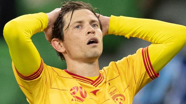 MELBOURNE, AUSTRALIA - MAY 13: Craig Goodwin of Adelaide United reacts during the A-League match between Melbourne City and Adelaide United at AAMI Park, on May 13, 2021, in Melbourne, Australia. (Photo by Mackenzie Sweetnam/Getty Images)