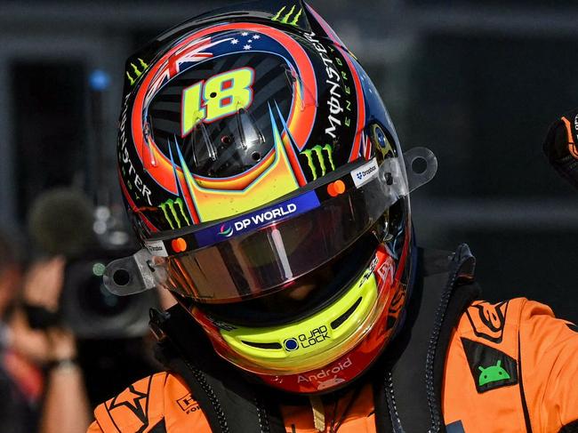 TOPSHOT - McLaren's Australian driver Oscar Piastri celebrates taking pole position in the qualifying session of the Formula One Chinese Grand Prix at the Shanghai International Circuit in Shanghai on March 22, 2025. (Photo by GREG BAKER / AFP)