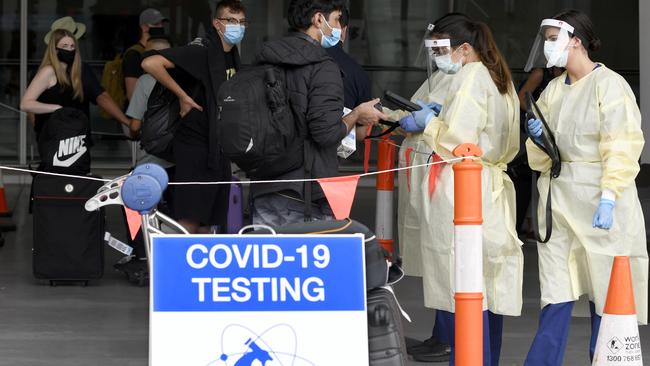 Interstate travellers line up to get tested for COVID outside of Adelaide Airport. Picture: NCA NewsWire / Naomi Jellicoe