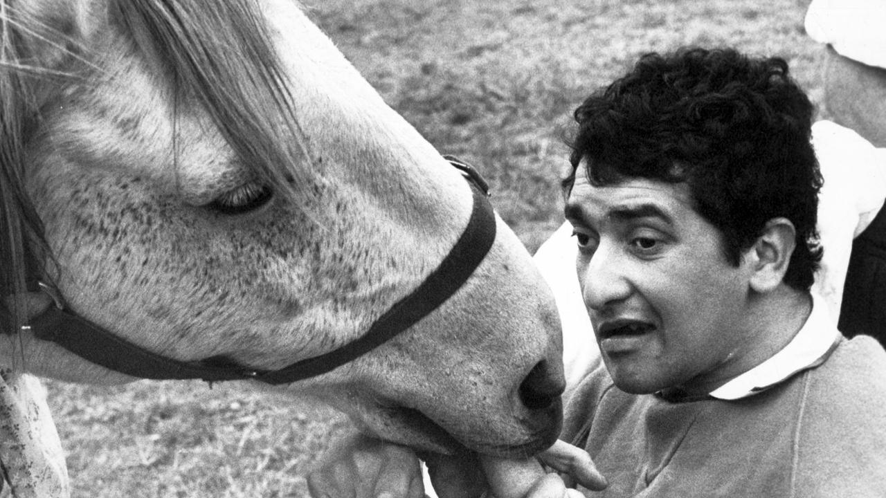 04/1986. Ricky Thurgood feeds carrots to Prince after the therapy session.