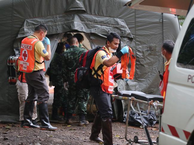 Military and police personnel at the quarantine tent in Tham Luang cave area. Picture: AFP/ Chiang Rai Public Relations Office