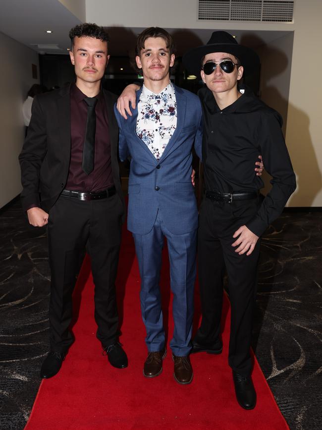 MELBOURNE, AUSTRALIA – JUNE 14 2024 Platon Georgiou, Max Humphrey and Max Edebohls attend the Lowanna College Senior Formal 2024 at the Moe Racing Club Picture: Brendan Beckett