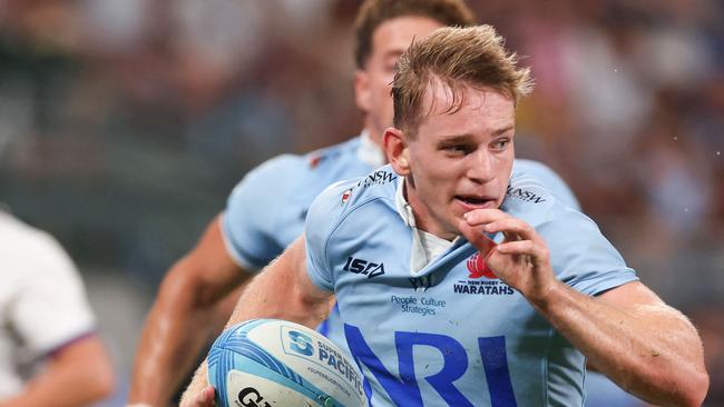 Waratahsâ Max Jorgensen runs with the ball for a successful try during the Super Rugby match between the NSW Waratahs and the Highlanders in Sydney on March 8, 2024. (Photo by Saeed KHAN / AFP) / -- IMAGE RESTRICTED TO EDITORIAL USE - STRICTLY NO COMMERCIAL USE --