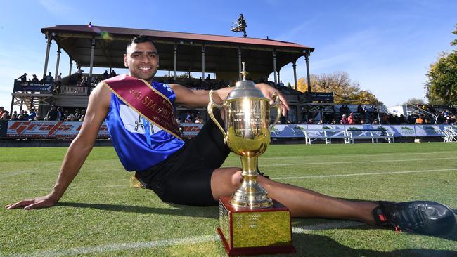 Dhruv Rodrigues Chico with the Stawell Gift trophy. Picture: AAP