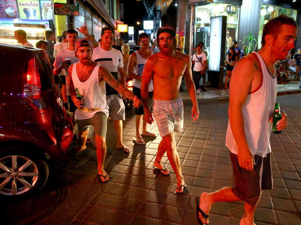 Schoolies and Toolies drunk on the streets in the nightclub strip stopping traffic in Kuta Bali. Picture: Nathan Edwards