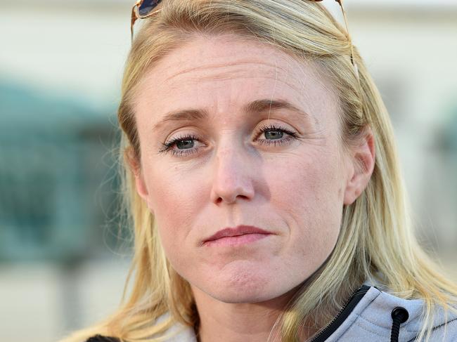 Australian Olympic athlete Sally Pearson is seen during a press conference at the Runaway Bay Athletics Centre on the Gold Coast, Thursday, June 30, 2016. The defending Olympic 100m hurdles champion has been ruled out of competing at the Rio Olympic Games after sustaining a hamstring tear during a training run on Monday. (AAP Image/Dave Hunt) NO ARCHIVING