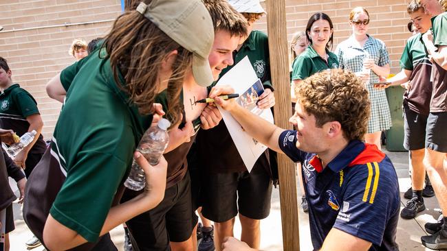 Harry Schoenberg signs a student’s chest during a visit to Waikerie High School for the The Advertiser Foundation Christmas Kids Appeal. Picture: Tom Huntley