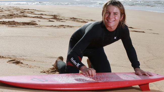 CENTRAL COAST EXPRESS ADVOCATE / AAP.Max Taylor poses for a photo with his surfboard on Wamberal Beach. Saturday 16th June 2019Max rescued a UK swimmer in March he was just 11-years-old at the time (now12)(AAP IMAGE / MARK SCOTT)