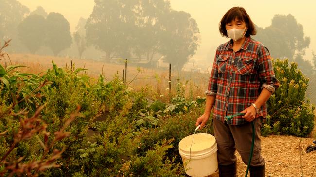 Cassandra Rolph, of Deep End Farm, on fire patrol in her garden near Geeveston. Picture: DAVID ROLPH