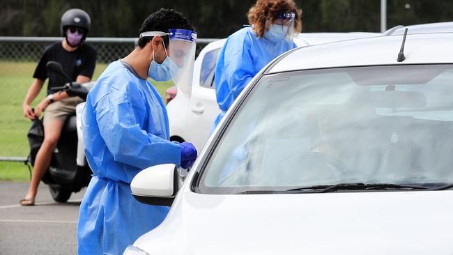 QML Pathology staff test Gold Coast locals who have to wait hours to be tested for Covid-19 at the Currumbin Eagles Rugby League Club which has turned into a Pop Up Testing. Picture: NCA NewsWire / Scott Powick