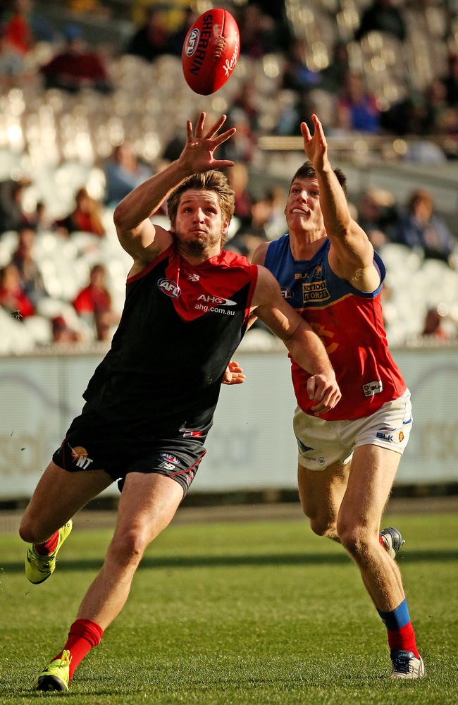 Melbourne forward Jesse Hogan beats Lions opponent Justin Clarke to the ball. Picture: Colleen Petch