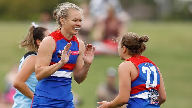 More goals are eexpected in season two of the AFLW if practice games are a guide. Aasta O'Connor celebrates one with Kirsty Lamb against Carlton. Picture: Getty Images