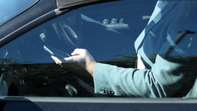 Under the new laws, a driver could lose their licence for text-driving. Picture: Liam Kidston.