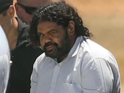 CARNARVON , AUSTRALIA - NOVEMBER 5: Terence Darrell Kelly boards a plane after being taken into custody by members of the Special Operations Group at Carnarvon airport on November 5, 2021 in Carnarvon , Australia. Kelly, 36, has been charged with various offences relating to the disappearance of Cleo Smith, 4, who was abducted from a campsite in the Gascoyne region on October 16th and found alive on November 3rd. He is being transported to Perth and will re-appear in court In December. (Photo by Tamati Smith/Getty Images)