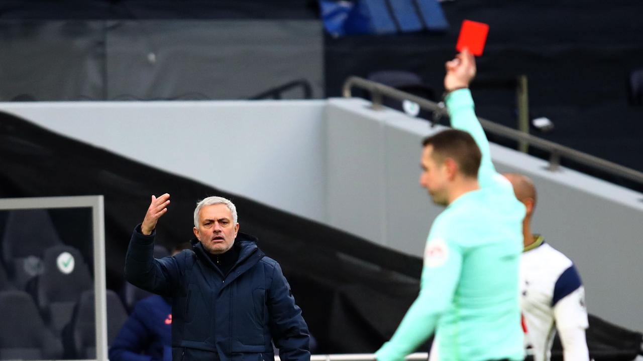 Jose Mourinho (left) has words with Coote during a Tottenham game in 2021. (Photo by Julian Finney/AFP)