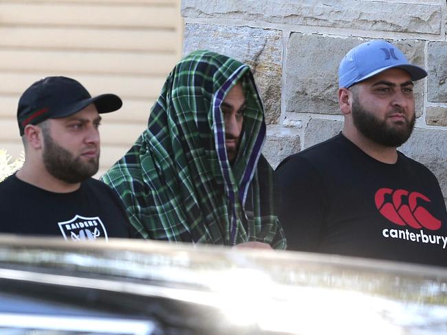 Mourners arrive at the funeral. Picture: Stephen Cooper