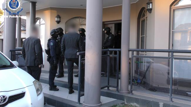 Police surround the home of one suspect. Picture: NSW Police