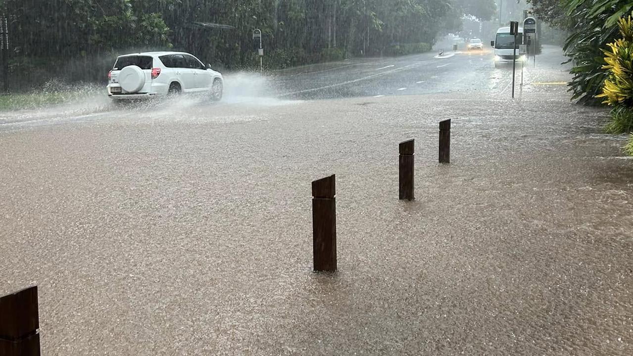 100mm deluge in less than two hours turns Cairns roads to creeks