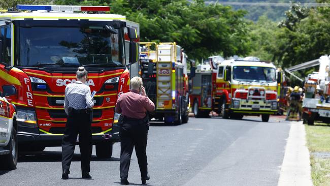 Queensland Fire and Emergency Services firefighters attend a large house fire at Christensen Street, Machans Beach. The blaze was contained quickly, with 6 fire trucks attending the emergency. No one was injured. Picture: Brendan Radke