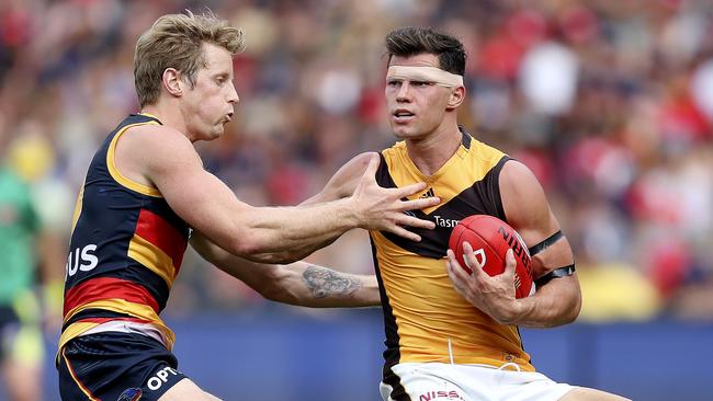 Hawthorn’s Jaeger O'Meara pushes aside Rory Sloane. Picture: Sarah Reed