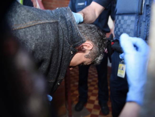 Accused killer Adrian Basham is led from Bairnsdale Magistrates’ Court. Picture: Lawrence Pinder