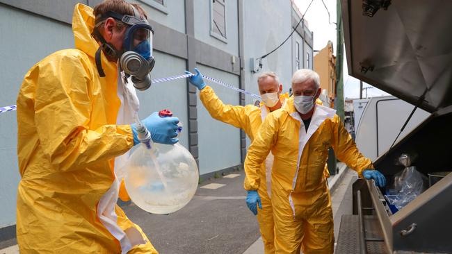 Victoria Police remove items from the former Daily Planet brothel in Elsternwick. Picture: Alex Coppel