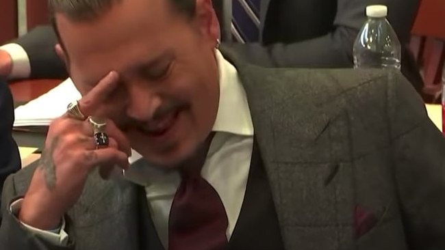 Johnny Depp in a fit of giggles when his penis is mentioned in court.