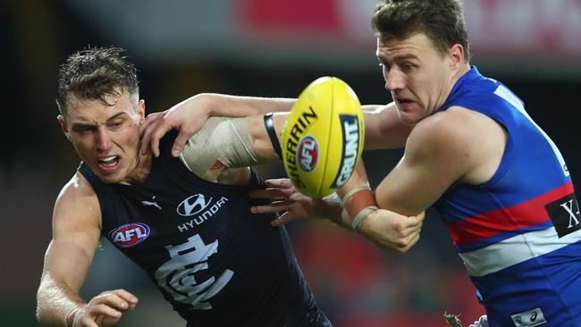 Carlton skipper Patrick Cripps competes with Bulldogs midfielder Jack Macrae in Round 6. Picture: Chris Hyde/Getty Images